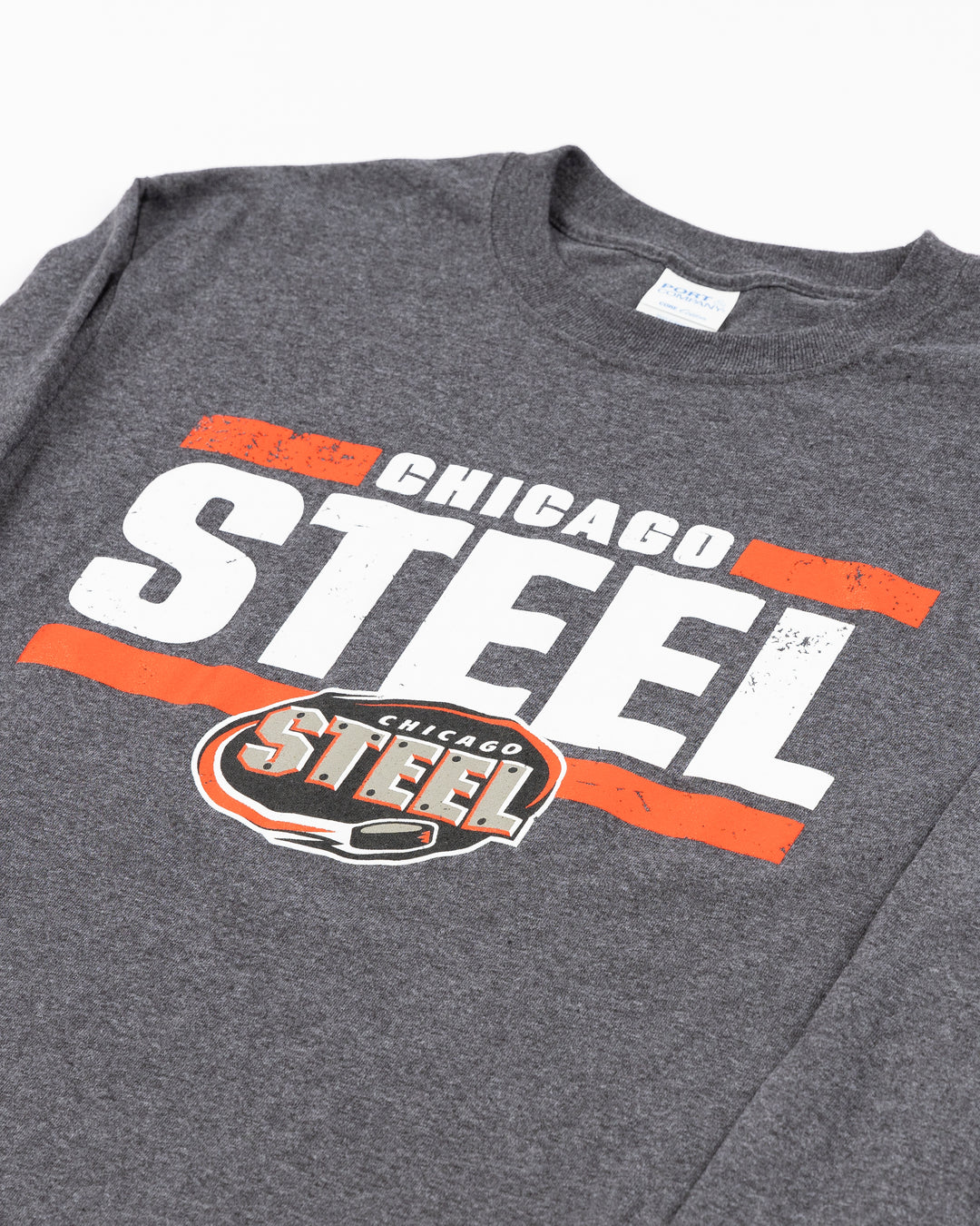 dark grey long sleeve tee with Chicago Steel hockey team wordmark and logo across front - front detail lay flat