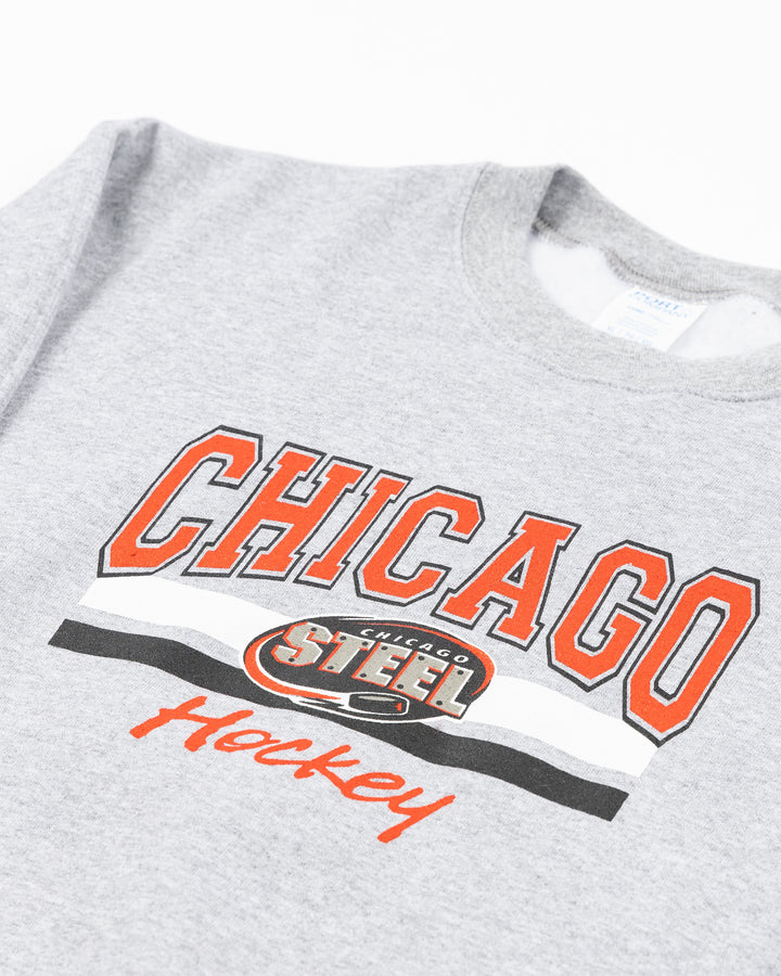 heather grey youth crewneck sweatshirt with Chicago Hockey wordmark and Chicago Steel logo across front - front detail lay flat