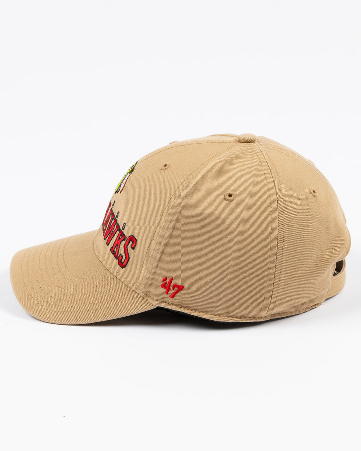 khaki '47 brand adjustable cap with Chicago Blackhawks wordmark and primary logo embroidered on front - left side lay flat