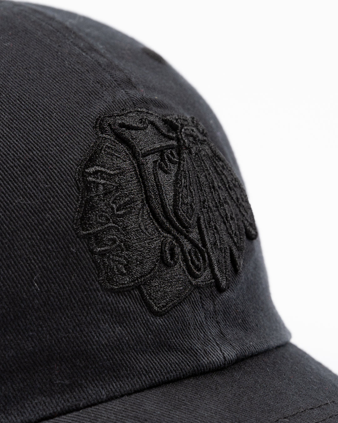 '47 brand adjustable black cap with tonal black Chicago Blackhawks primary logo embroidered on front - front detail lay flat