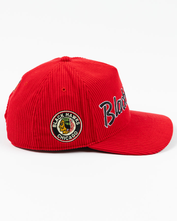 red corduroy '47 brand adjustable hat with embroidered Chicago Blackhawks wordmark on front and vintage logo on right side - right side lay flat