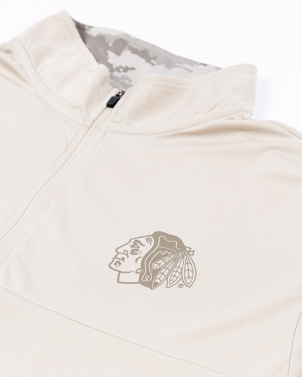 white Colosseum OHT quarter zip with Chicago Blackhawks primary logo on left chest and decorations on sleeves with camo detailing on sides - front detail lay flat