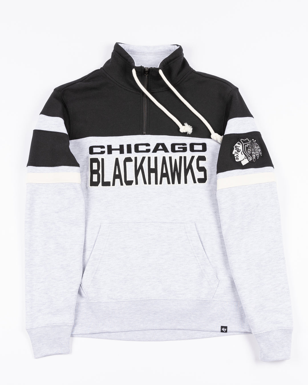 color blocked black and light grey '47 brand quarter zip with Chicago Blackhawks wordmark embroidered on front and primary logo on left shoulder - front lay flat