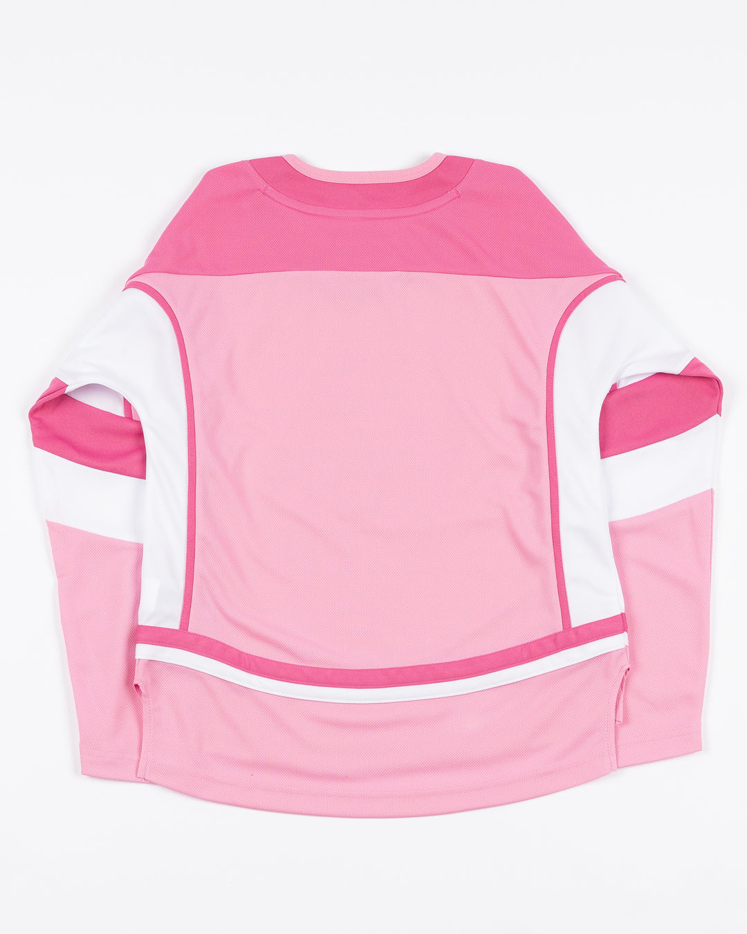 blank pink toddler hockey jersey with Chicago Blackhawks primary logo on front - back lay flat