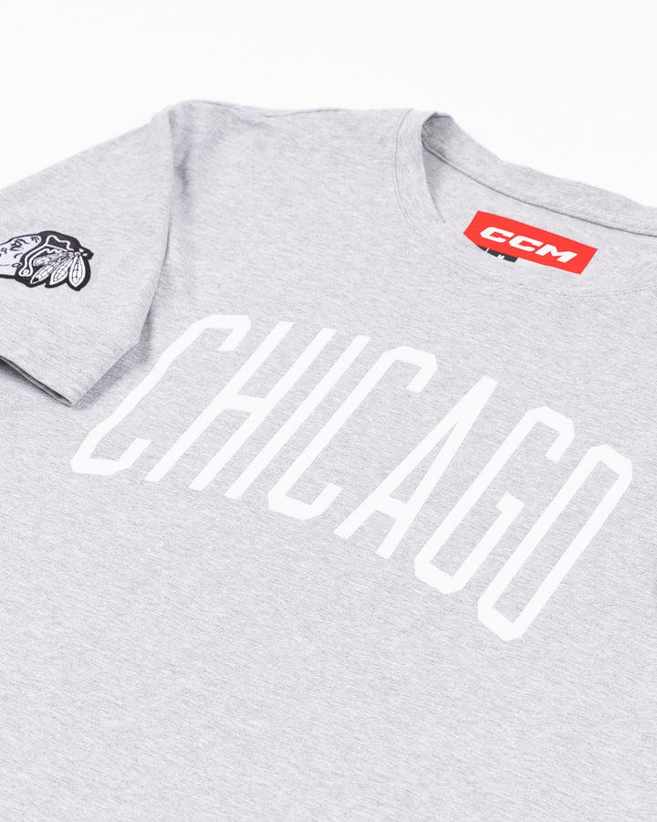 athletic grey CCM short sleeve tee with Chicago wordmark on front and tonal primary logo embroidered on right shoulder - front detail lay flat