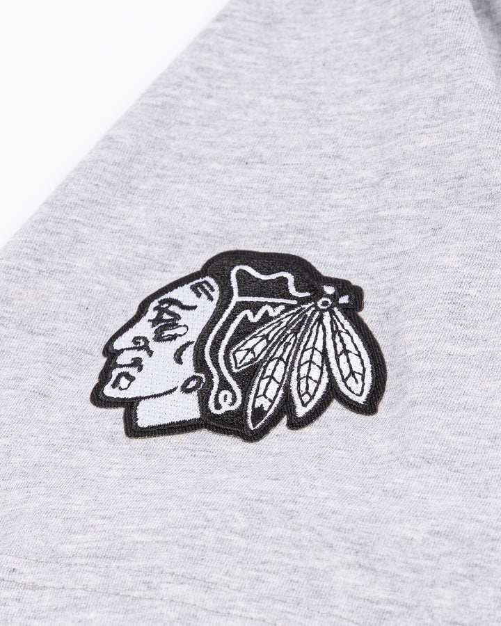 athletic grey CCM short sleeve tee with Chicago wordmark on front and tonal primary logo embroidered on right shoulder - shoulder detail lay flat