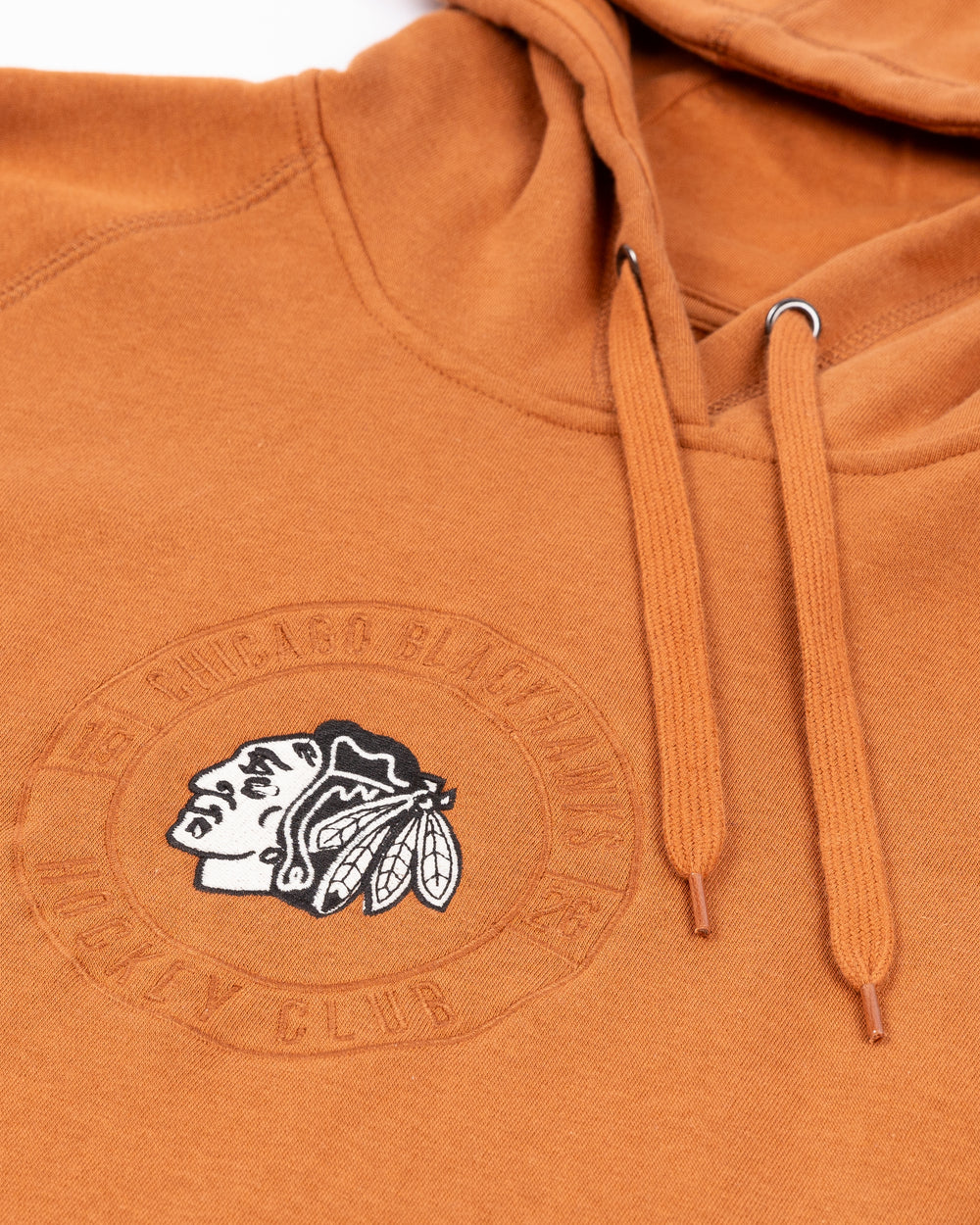 brown CCM hoodie with black and white Chicago Blackhawks primary logo on center with round wordmark on front - front detail lay flat