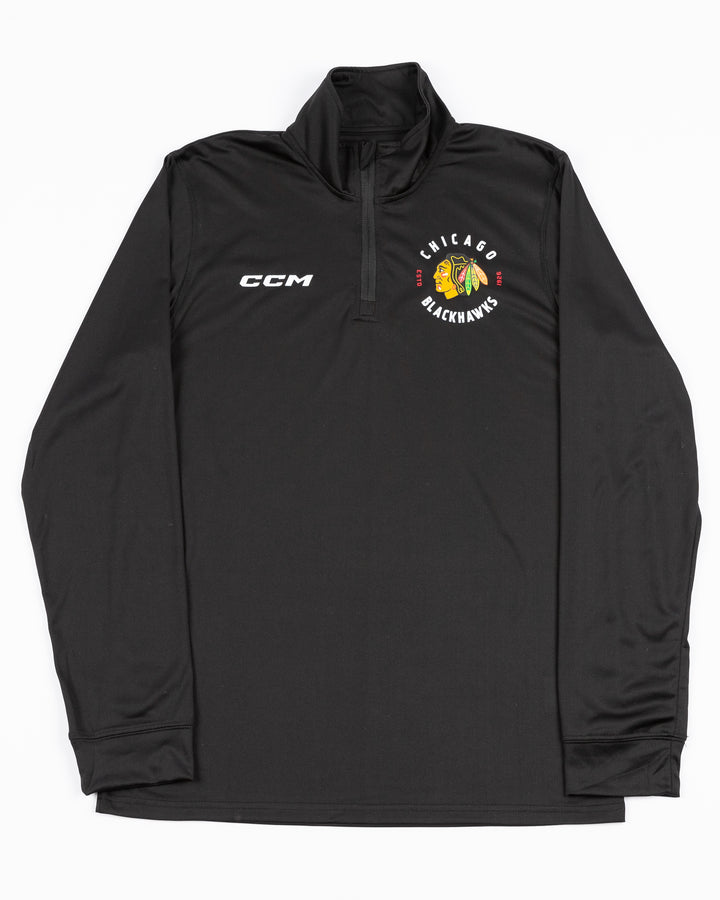 black CCM quarter zip with Chicago Blackhawks primary logo and wordmark on left chest and CCM logo on right chest - front lay flat