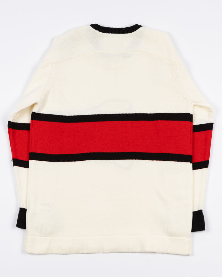 white CCM sweater with red and black stripe on center with Chicago Blackhawks primary logo across front with lace neck details - back lay flat