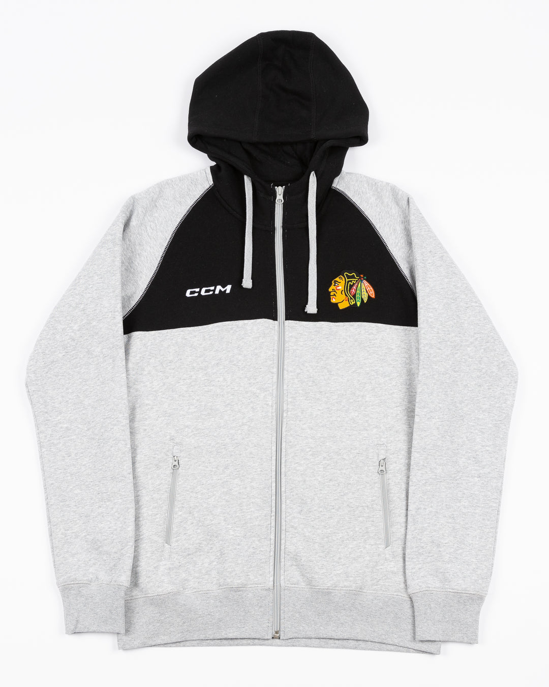 two-tone grey and blac CCM full zip hoodie with Chicago Blackhawks primary logo on left chest and CCM logo on right chest - front lay flat