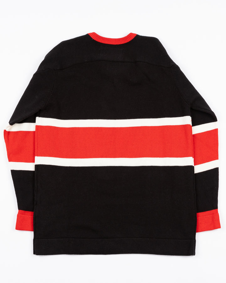 black CCM heritage sweater with vintage Chicago Blackhawks logo across front and lace detail on neck - back lay flat