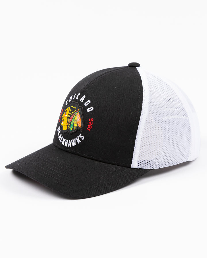 black and white CCM trucker cap with Chicago Blackhawks primary logo and wordmark on front - left angle lay flat