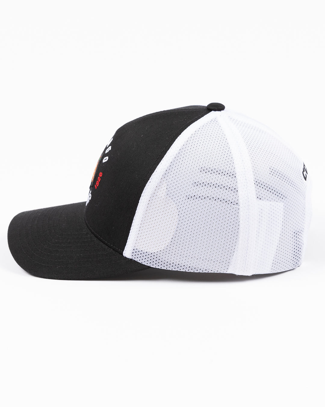 black and white CCM trucker cap with Chicago Blackhawks primary logo and wordmark on front - left side lay flat