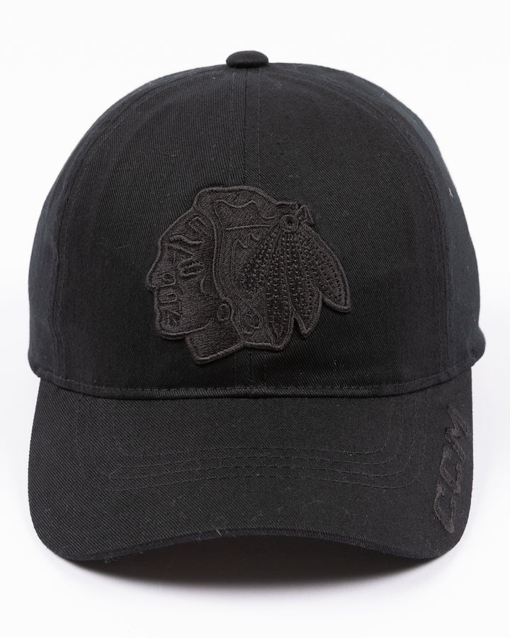 black CCM adjustable hat with tonal Chicago Blackhawks primary logo on front and tonal CCM logo on brim - front lay flat