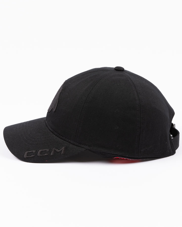 black CCM adjustable hat with tonal Chicago Blackhawks primary logo on front and tonal CCM logo on brim - left side lay flat