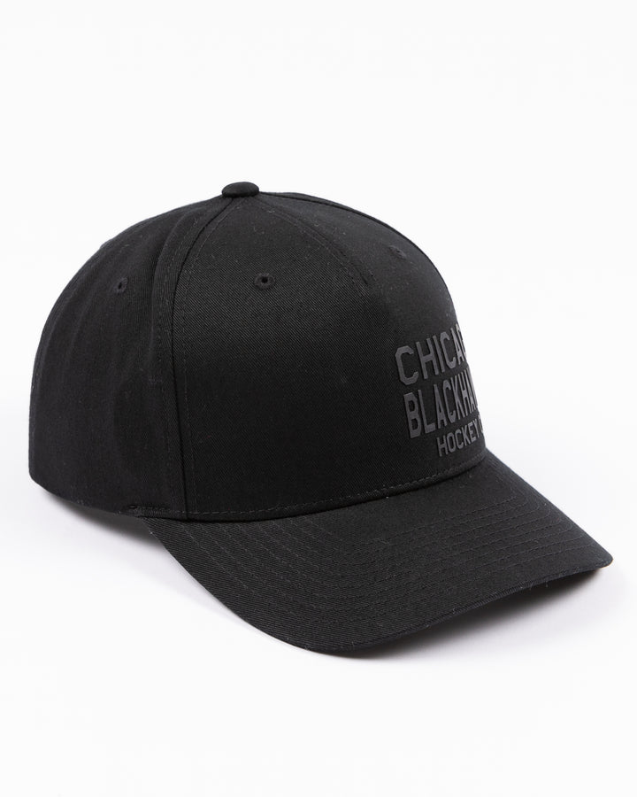 black CCM adjustable hat with Chicago Blackhawks Hockey Club tonal wordmark on front - right angle lay flat