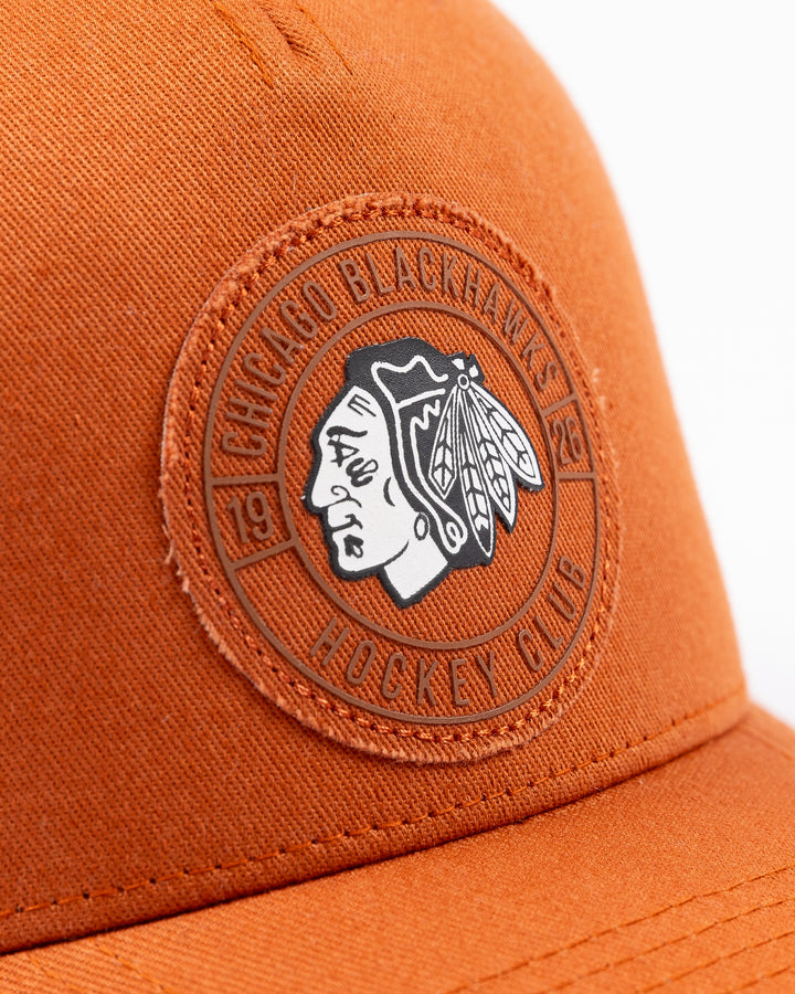 brown CCM adjustable hat with black and white Chicago Blackhawks primary logo surrounded by a tonal wordmark on the front - front detail lay flat