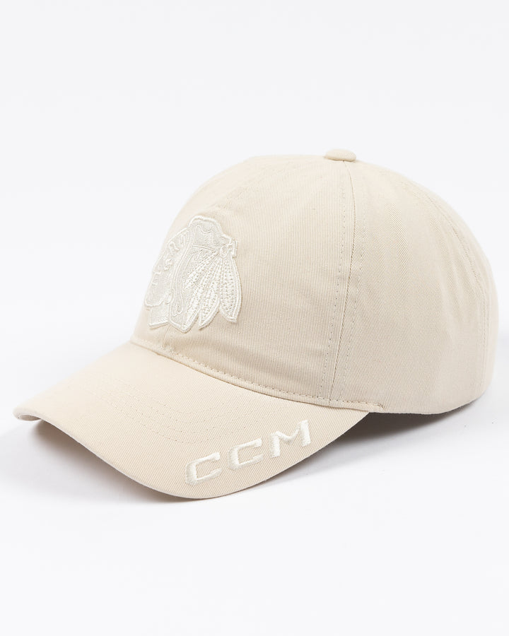 white CCM adjustable hat with tonal Chicago Blackhawk primary logo on front and tonal CCM logo on brim - left angle lay flat