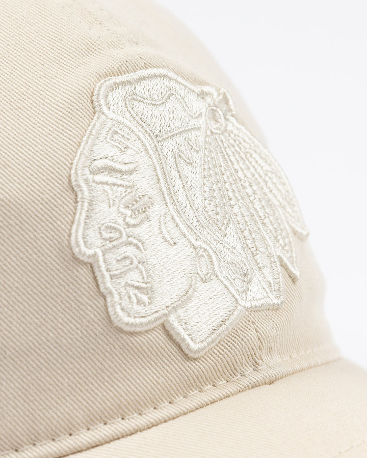 white CCM adjustable hat with tonal Chicago Blackhawk primary logo on front and tonal CCM logo on brim - front detail lay flat