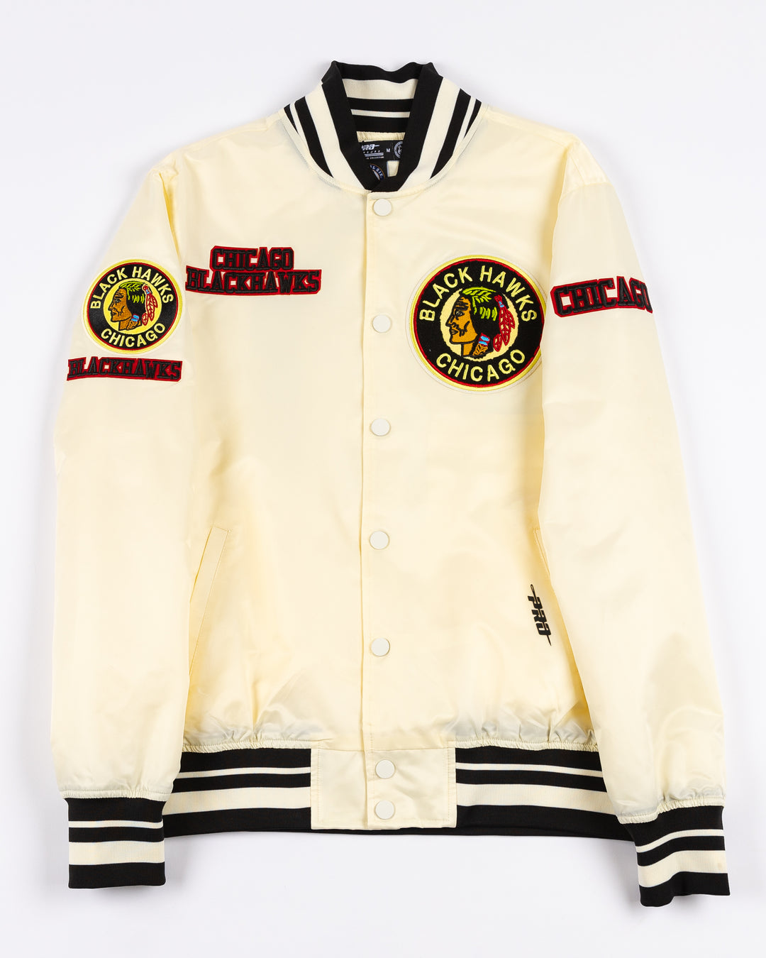 cream satin Pro Standard varsity jacket with vintage Chicago Blackhawks patches on shoulders, chest and back - front lay flat