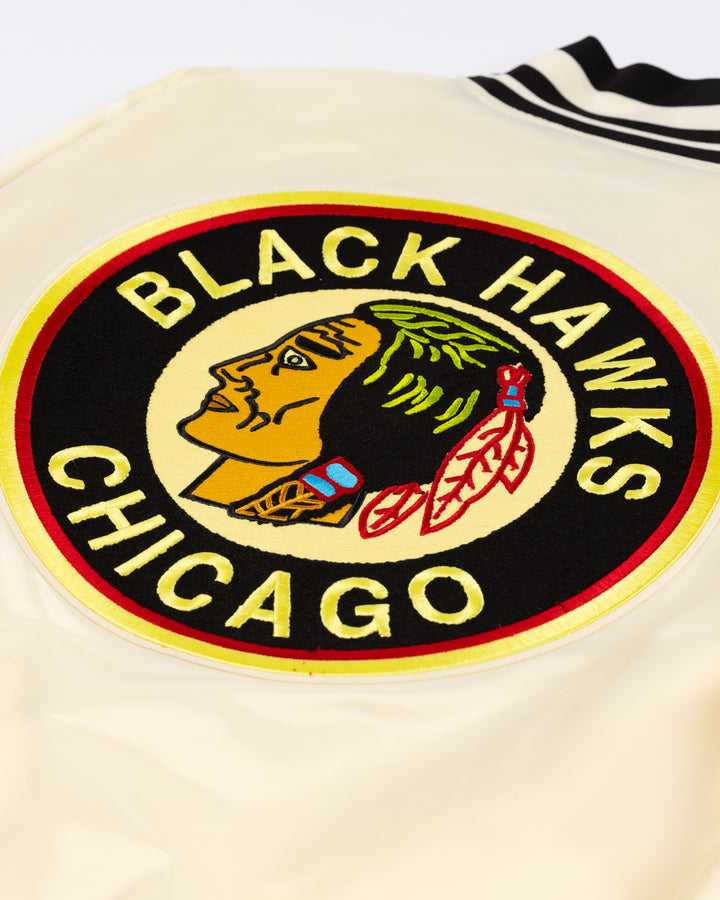 cream satin Pro Standard varsity jacket with vintage Chicago Blackhawks patches on shoulders, chest and back - back detail lay flat