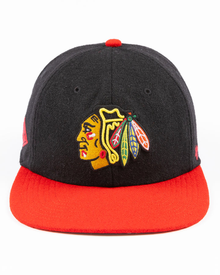 two tone black and red adjustable '47 brand hat with Chicago Blackhawks primary logo on front and CHI logo on right side - front lay flat