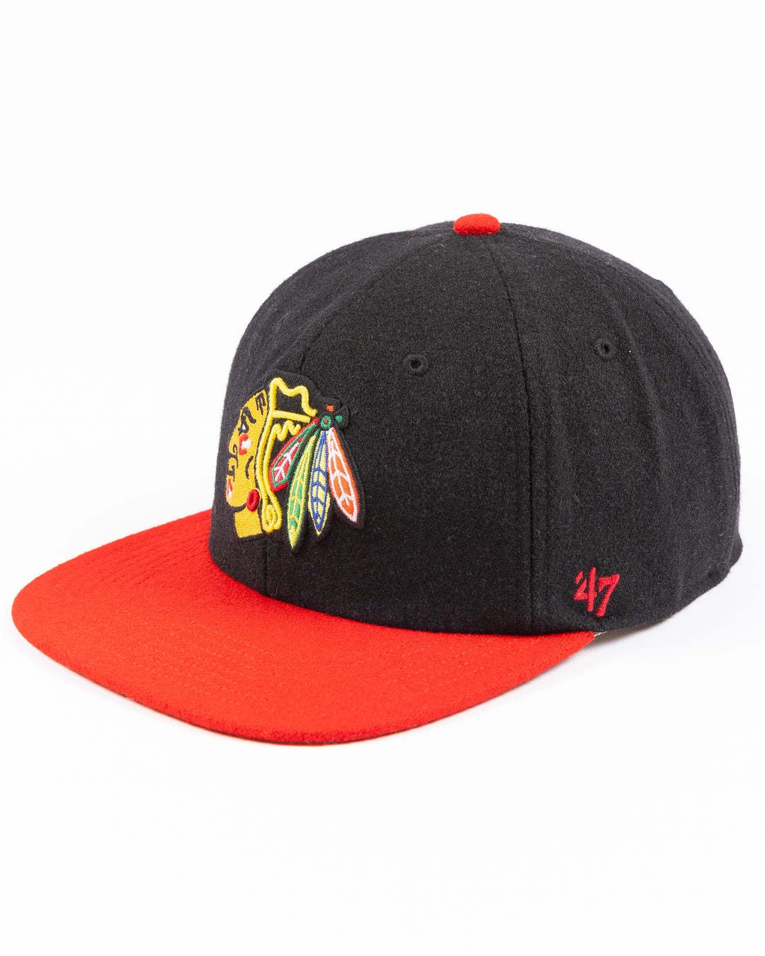 two tone black and red adjustable '47 brand hat with Chicago Blackhawks primary logo on front and CHI logo on right side - left angle lay flat