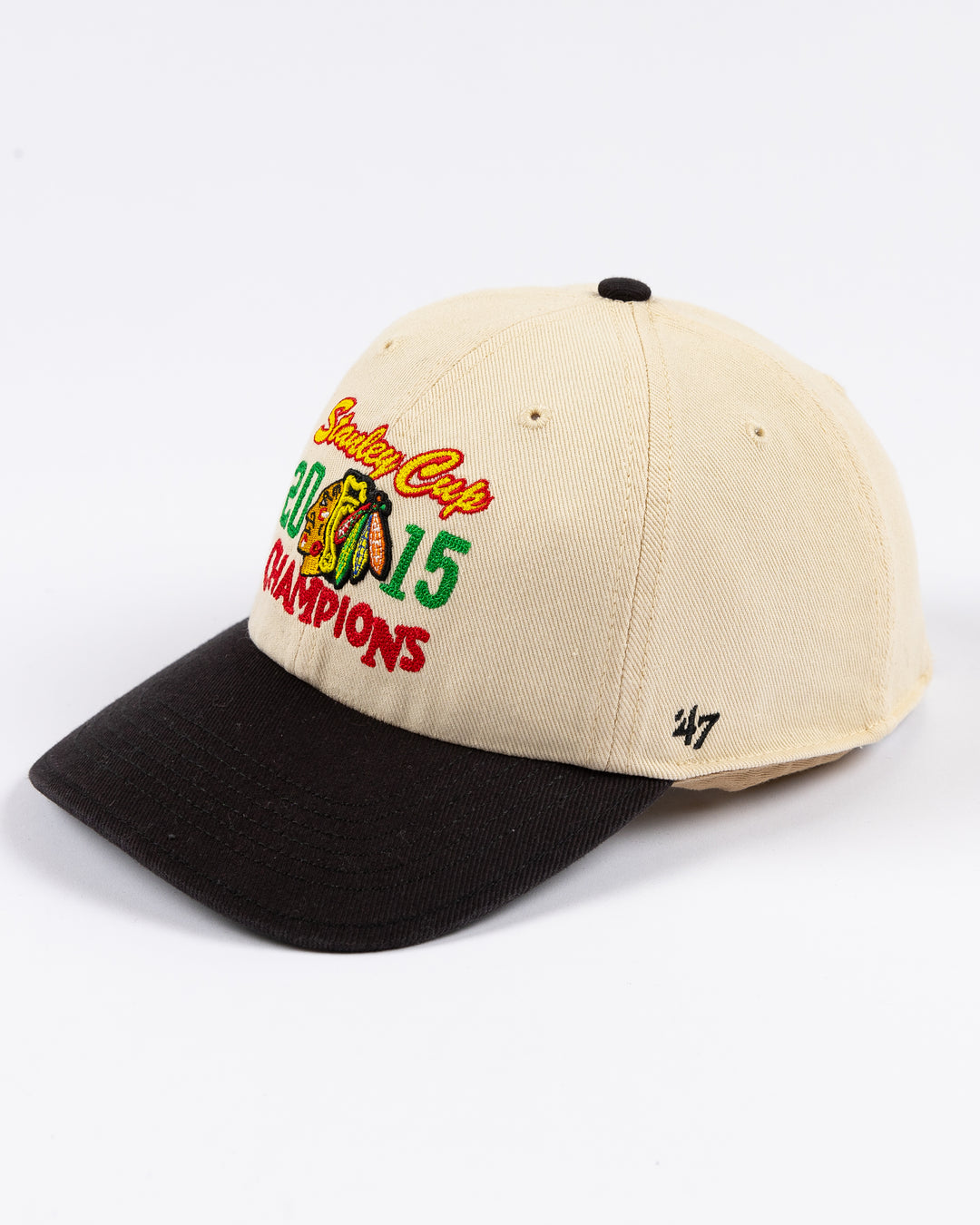 two tone cream and black '47 brand adjustable hat with stitched Chicago Blackhawks Stanley Cup Champions design on front - left angle lay flat