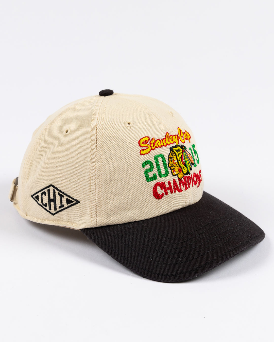 two tone cream and black '47 brand adjustable hat with stitched Chicago Blackhawks Stanley Cup Champions design on front - right angle lay flat