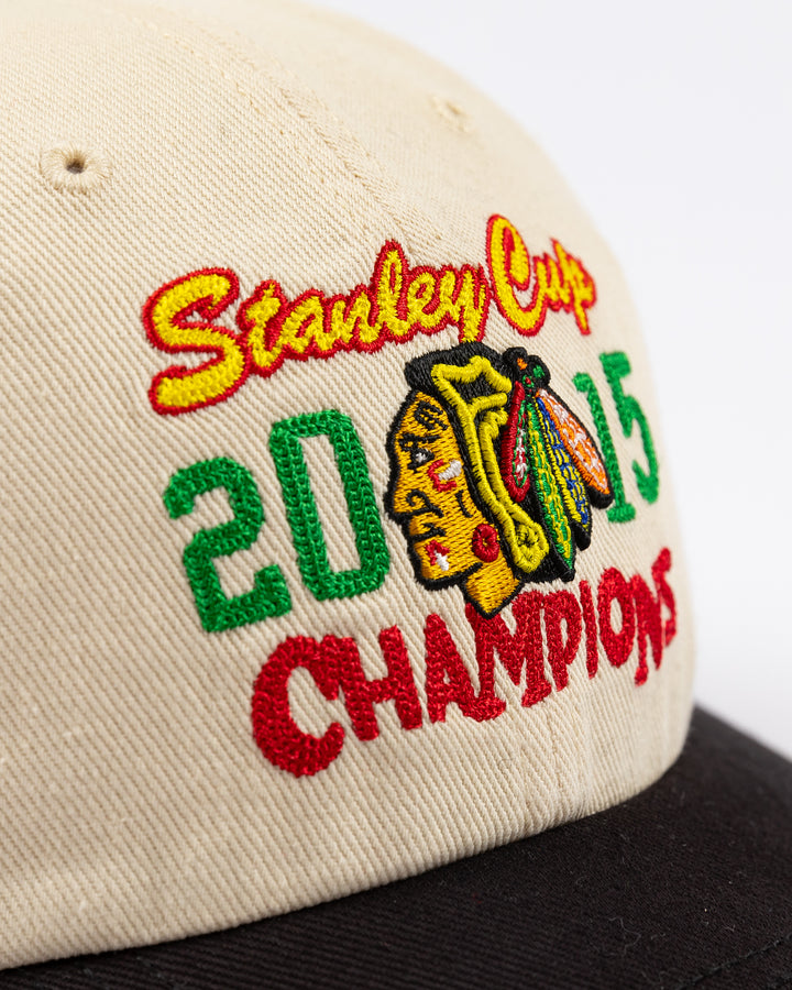 two tone cream and black '47 brand adjustable hat with stitched Chicago Blackhawks Stanley Cup Champions design on front - front detail lay flat