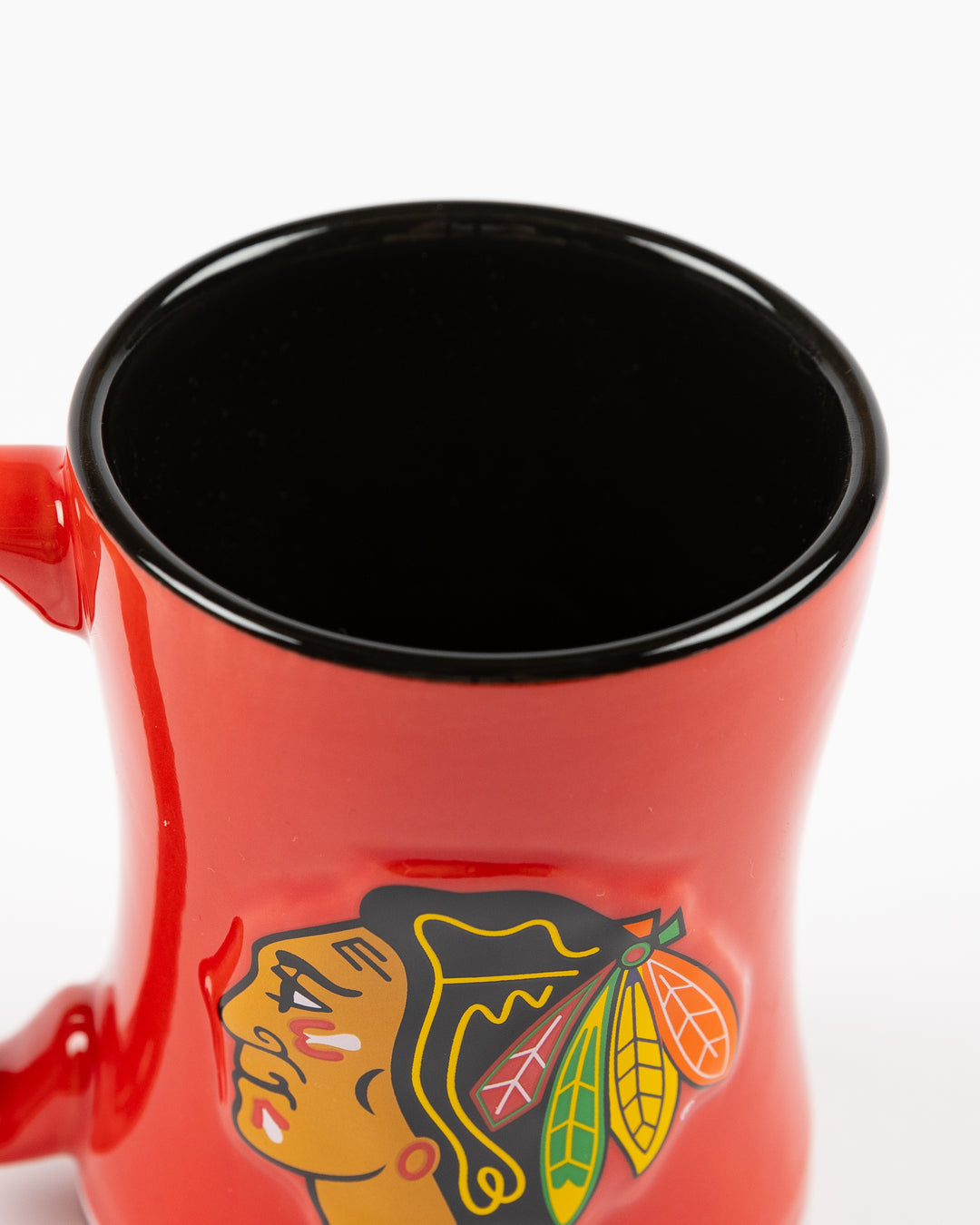 red ceramic mug inspired by Chicago Blackhawks hockey jersey with primary logo on front - front detail lay flat