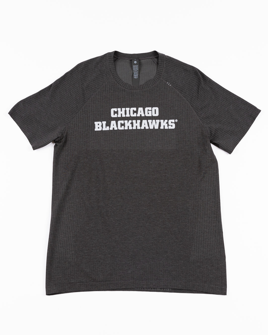 black lululemon short sleeve tee with Chicago Blackhawks wordmark across front - front lay flat