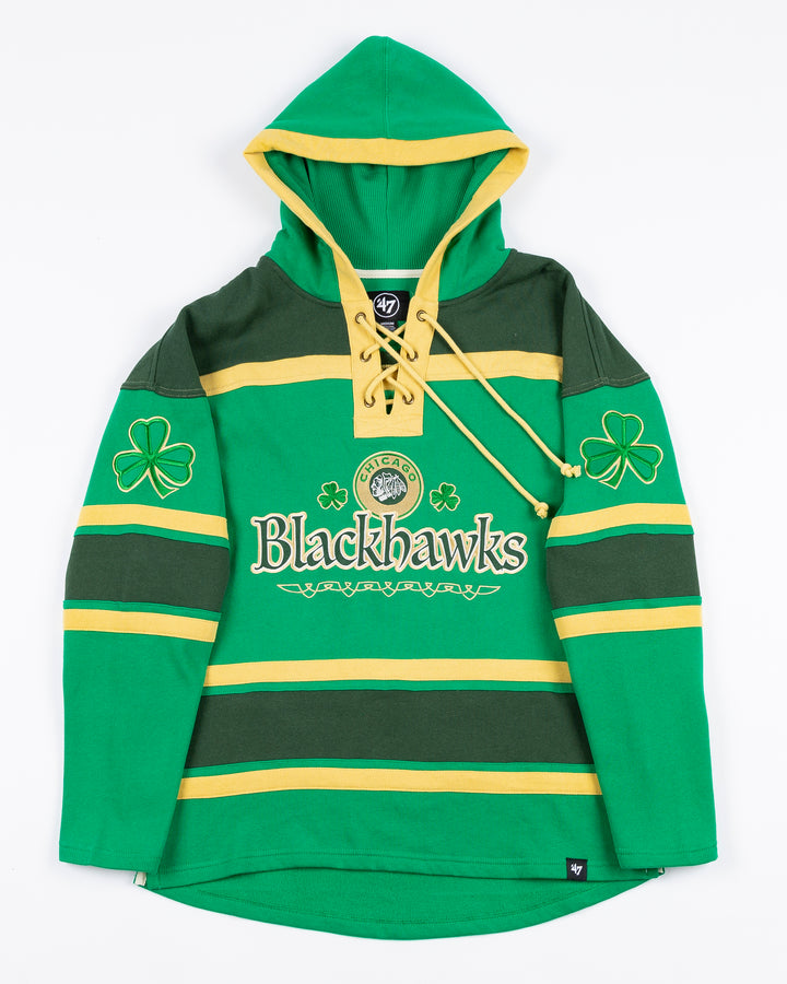 green and gold '47 brand hockey jersey inspired lacer hoodie with Irish inspired Blackhawks design on front and shamrocks on sleeves - front lay flat