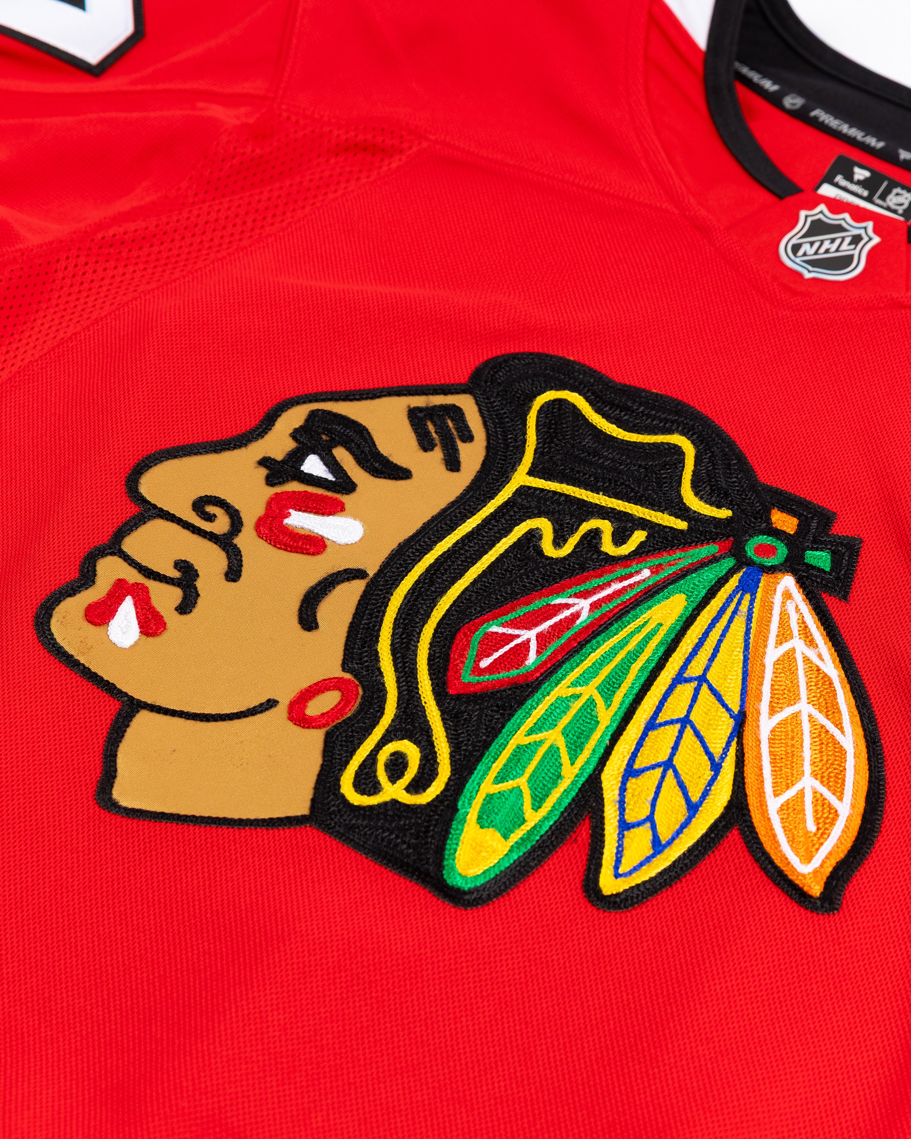 red Fanatics Premium Chicago Blackhawks home jersey with Nick Foligno name and number - front detail lay flat