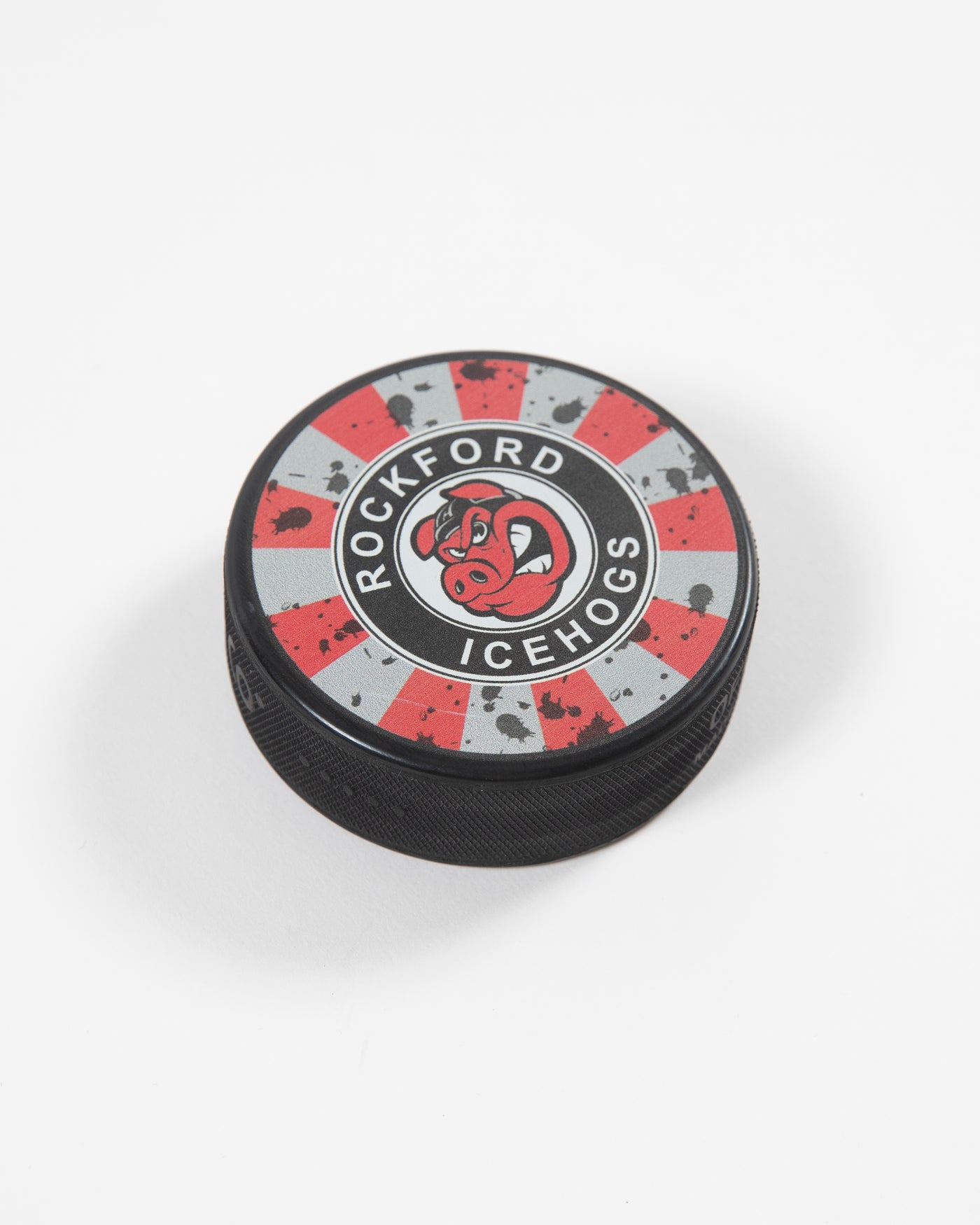 Red and grey distressed Rockford IceHogs hockey puck - angled lay flat