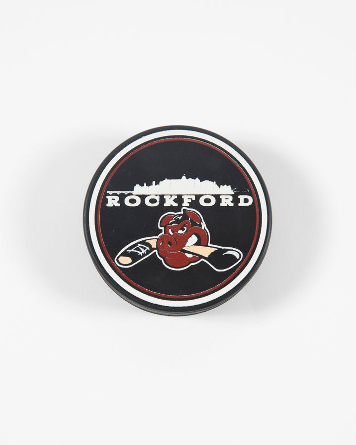 Black Rockford IceHogs hockey puck with skyline graphic - front lay flat