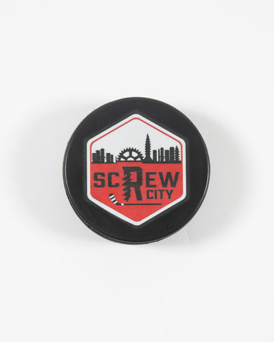 Black Rockford IceHogs Screw City hockey puck with screw skyline inspired design - front lay flat