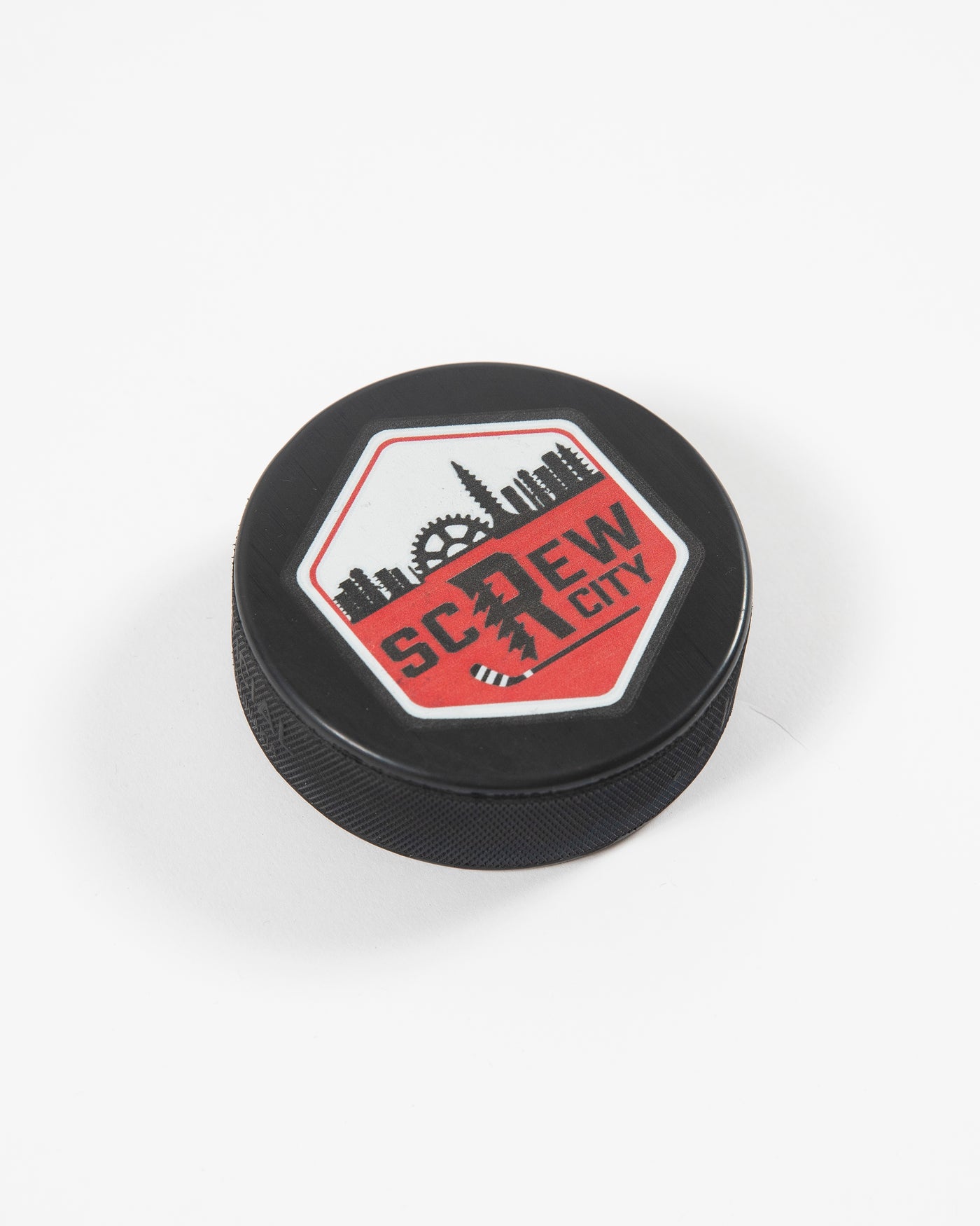 Black Rockford IceHogs Screw City hockey puck with screw skyline inspired design - angled lay flat