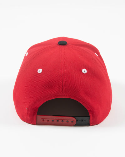 Black and red flat brim adjustable cap with Rockford IceHogs classic logo embroidered on front - back lay flat