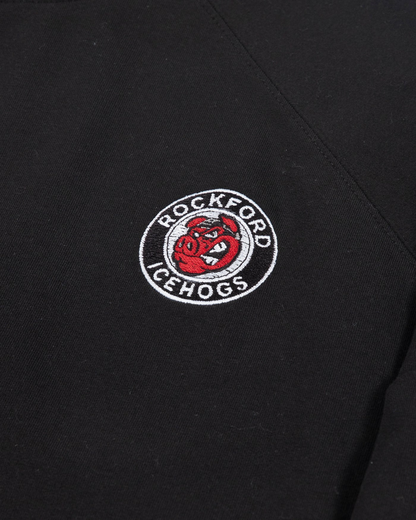 Black Rockford IceHogs crewneck with embroidered logo on left chest and embroidered wordmark on left cuff - detail lay flat