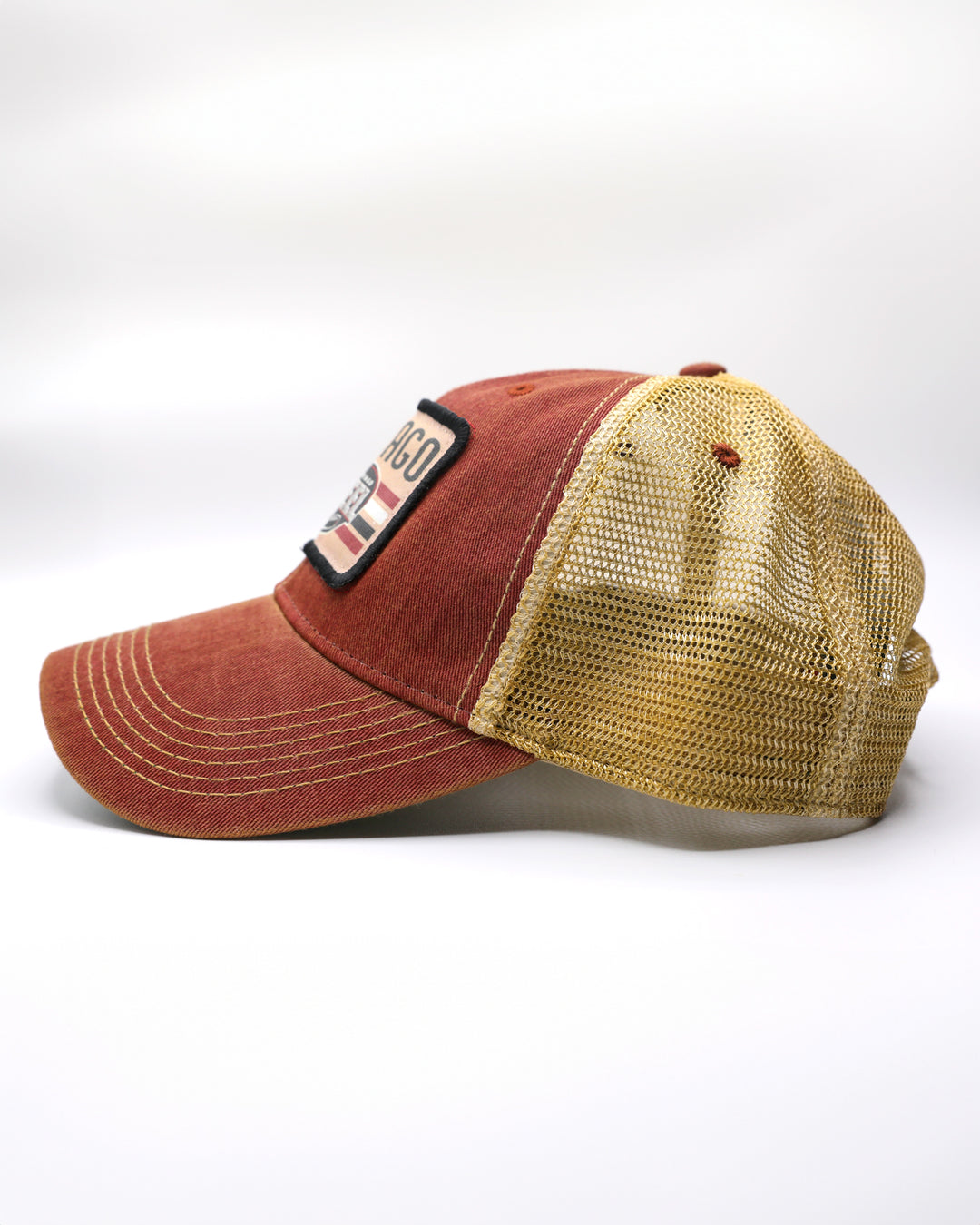 rust and tan adjustable trucker cap with Chicago Steel patch on front - left side lay flat