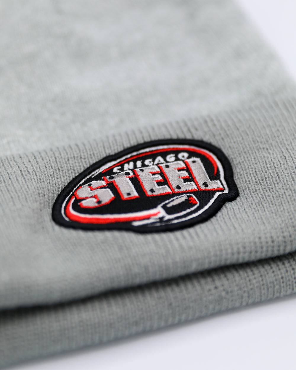 grey Chicago Steel marled Legacy knit beanie with grey cuff and grey pom - front detail lay flat