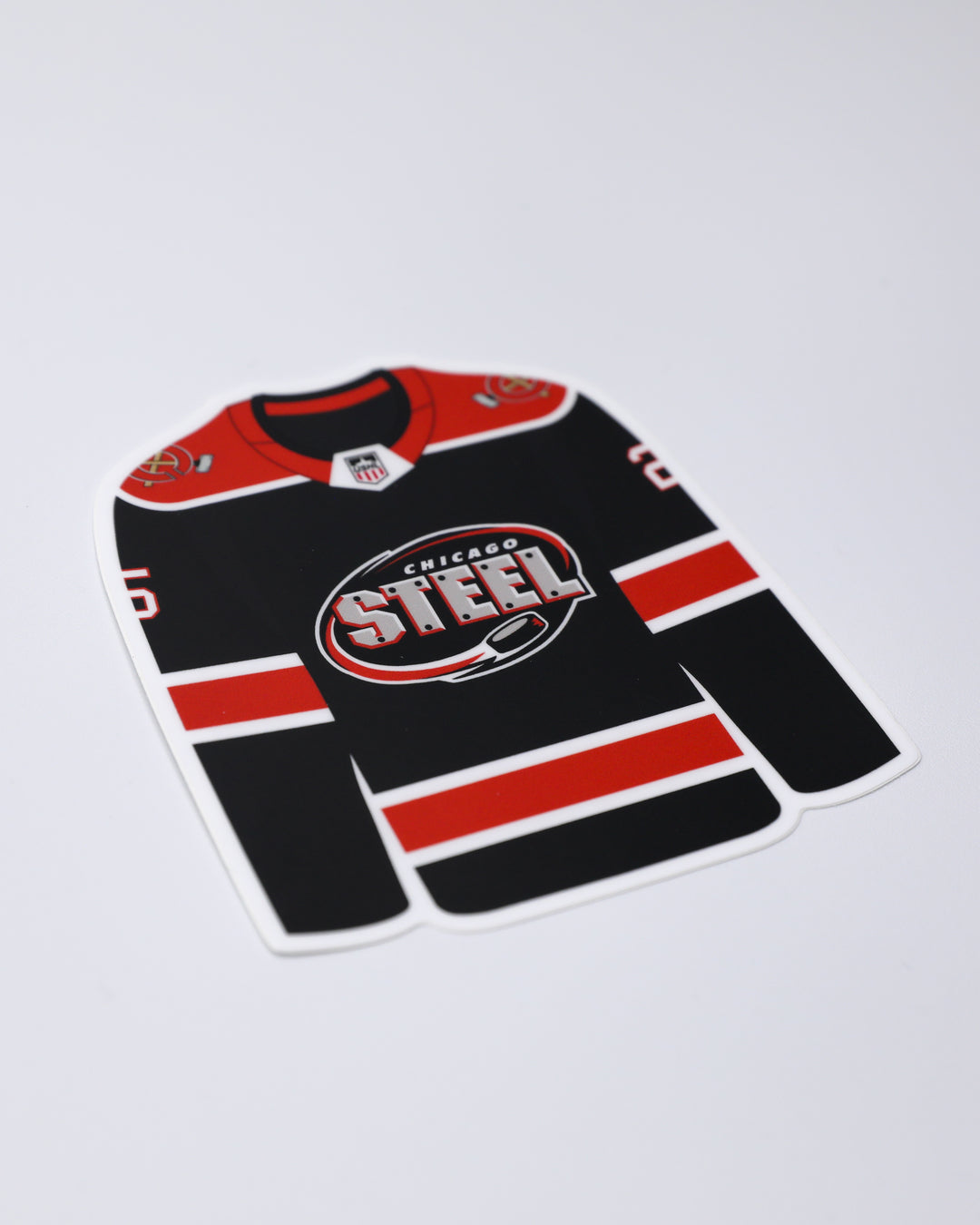 sticker pack of Chicago Steel jersey, 25th season graphic, classic logo and mascot - front angled lay flat of jersey