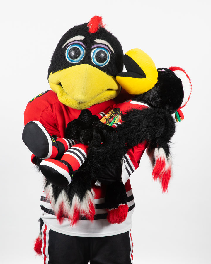 Chicago Blackhawks mascot Tommy Hawk holding 35 inch Tommy Hawk plush