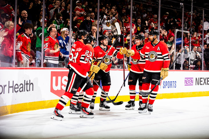 Chicago Blackhawks players Kurashev, Martinez, Nazar, Bertuzzi and Jones celebrating Kurashev goal against Toronto Maple Leaves