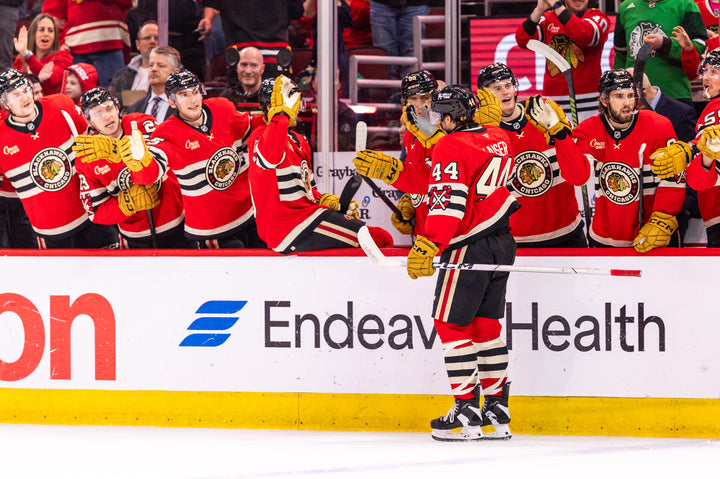 Chicago Blackhawks players celebrating Wyatt Kaiser goal during Utah game