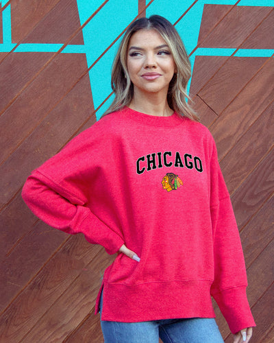 red ladies crewneck with Chicago wordmark and Chicago Blackhawks primary logo across front - on figure