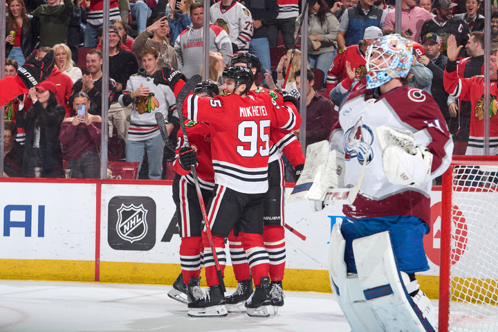 Chicago Blackhawks players celebrating goal scored by Ilya MIkheyev