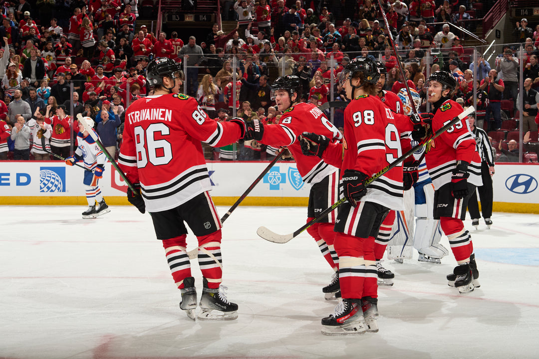 Chicago Blackhawks players Teravainen, Donato, Bedard, Jone and Bertuzzi celebrating Donato goal scored against Edmonton Oilers on February 5, 2025