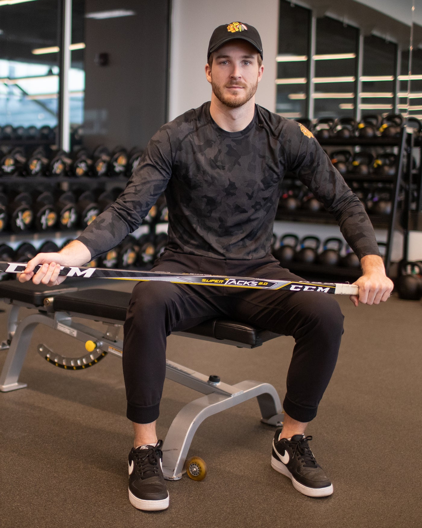Taylor Raddysh in black camo lululemon long sleeve tee with primary logo on left shoulder